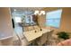 Dining area with modern table set, elegant chandelier, and large window at 14112 Queenside St, Orlando, FL 32824
