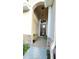 Inviting front entrance with decorative plants, stone accents and hanging light fixture at 14112 Queenside St, Orlando, FL 32824