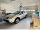 Spacious two-car garage with vehicle, washer/dryer and ample storage space at 14112 Queenside St, Orlando, FL 32824