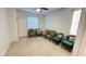 Inviting living room featuring tile flooring, natural light, and stylish seating arrangements at 14112 Queenside St, Orlando, FL 32824