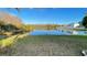 Picturesque pond view with lush greenery, reflecting a serene and natural setting at 14112 Queenside St, Orlando, FL 32824