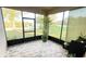 Relaxing screened patio offering views of the lush green landscape at 14112 Queenside St, Orlando, FL 32824