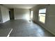 Spacious living room with tile flooring, neutral walls, and ample natural light at 1629 Ambar Ct, Winter Haven, FL 33881
