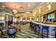 This photo showcases a fully equipped bar with modern seating and a stylish design within the club's amenities at 1646 Moon Valley Dr, Davenport, FL 33896