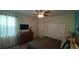 Bedroom featuring a full-size bed, plush carpet, dresser and a modern flat screen television at 1646 Moon Valley Dr, Davenport, FL 33896