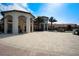 Capture the essence of luxury in this clubhouse view, featuring beautiful landscaping with a fountain and lounge areas at 1646 Moon Valley Dr, Davenport, FL 33896