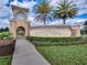 Welcoming entrance to ChampionsGate community with lush landscaping and clear signage at 1646 Moon Valley Dr, Davenport, FL 33896