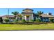 Beautiful Florida home with lush landscaping and well-manicured lawn at 1646 Moon Valley Dr, Davenport, FL 33896