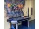 Finished garage with air hockey table and Marvel-themed mural at 1646 Moon Valley Dr, Davenport, FL 33896