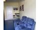 Finished garage with comfy seating and small bar table at 1646 Moon Valley Dr, Davenport, FL 33896