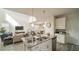 Open concept kitchen with a large island, stainless steel appliances and pendant lighting at 1646 Moon Valley Dr, Davenport, FL 33896