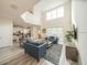 Bright and airy living room with an open concept, high ceilings and luxury vinyl plank flooring at 1646 Moon Valley Dr, Davenport, FL 33896
