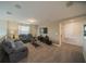 Upstairs living room area featuring comfortable seating, contemporary décor, and lots of natural light at 1646 Moon Valley Dr, Davenport, FL 33896