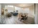 Open floor plan featuring living and dining spaces with luxury vinyl plank flooring and lots of natural light at 1646 Moon Valley Dr, Davenport, FL 33896