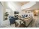 Spacious living room featuring high ceilings, comfortable seating, and a large TV at 1646 Moon Valley Dr, Davenport, FL 33896