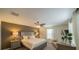 Cozy main bedroom with a comfortable king bed, stylish lamps, and a relaxing seating area at 1646 Moon Valley Dr, Davenport, FL 33896