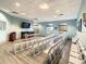 Community meeting room offers ample seating, natural light, and a modern aesthetic at 1646 Moon Valley Dr, Davenport, FL 33896
