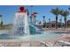 Community splash pad close up on water features and surrounding palm trees at 1646 Moon Valley Dr, Davenport, FL 33896