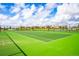 Enjoy a match on this pristine tennis court, offering a great amenity and recreational space for residents and guests at 1646 Moon Valley Dr, Davenport, FL 33896