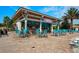 Picture of The Oasis Tiki Bar, featuring ample seating, inviting atmosphere, and festive signage at 1646 Moon Valley Dr, Davenport, FL 33896
