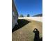 Spacious backyard featuring a well-kept lawn, a white fence, and abundant sunlight at 1664 Redfin Dr, Kissimmee, FL 34759
