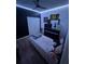 This bedroom includes decorative lighting, a ceiling fan, and a dark accent wall at 1664 Redfin Dr, Kissimmee, FL 34759