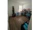 Bonus room with wood-look flooring and ample space for storage at 1664 Redfin Dr, Kissimmee, FL 34759
