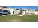 Charming single-story home with a well-manicured lawn and a neatly paved driveway at 1664 Redfin Dr, Kissimmee, FL 34759