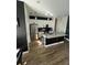 Modern kitchen featuring white cabinets, stainless steel appliances, and a large granite island at 1664 Redfin Dr, Kissimmee, FL 34759
