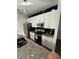 View of the kitchen featuring stainless steel appliances and granite counters at 1664 Redfin Dr, Kissimmee, FL 34759