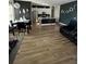 Open concept living room featuring modern design, dining area, and updated kitchen at 1664 Redfin Dr, Kissimmee, FL 34759