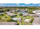 An aerial view shows the community, highlighting the pool, pond, and fountain at 1695 Lee Rd # E103, Winter Park, FL 32789