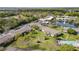 Aerial view displays the community's layout, including landscaping, recreational areas, and water features at 1695 Lee Rd # E103, Winter Park, FL 32789
