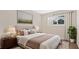 Cozy bedroom with a tufted headboard, soft lighting, and a view from the window, all on a plush rug at 1695 Lee Rd # E103, Winter Park, FL 32789