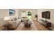Inviting living room features contemporary furnishings and bright sliding glass doors at 1695 Lee Rd # E103, Winter Park, FL 32789