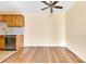 Bright living space with open kitchen, new floors, and neutral wall paint at 1695 Lee Rd # E103, Winter Park, FL 32789