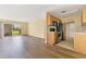 Open living space with sliding glass door and adjacent kitchen with stainless appliances at 1695 Lee Rd # E103, Winter Park, FL 32789