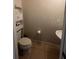 Compact powder room featuring a pedestal sink, tile flooring, and built-in storage shelves at 1749 Fulfillment Dr, Kissimmee, FL 34744