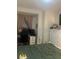 Well lit bedroom includes closet and comfortable green bed at 1749 Fulfillment Dr, Kissimmee, FL 34744