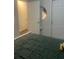 Well lit bedroom includes closet and comfortable green bed at 1749 Fulfillment Dr, Kissimmee, FL 34744