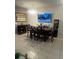 Open dining area featuring a large table, pendant lighting, and a wall-mounted television at 1749 Fulfillment Dr, Kissimmee, FL 34744