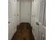 Long hallway features wood floors and multiple white paneled doors at 1749 Fulfillment Dr, Kissimmee, FL 34744