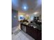 Open kitchen with modern appliances, dark countertops, and easy access to the living area at 1749 Fulfillment Dr, Kissimmee, FL 34744