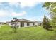 Spacious backyard with ample green space extending from the rear of the home at 1877 River Crest Ave, St Cloud, FL 34771