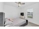 Bedroom featuring a ceiling fan, carpet, and a window with blinds at 1877 River Crest Ave, St Cloud, FL 34771