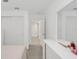 Bright bedroom showcasing neutral décor, carpet flooring and a large closet at 1877 River Crest Ave, St Cloud, FL 34771