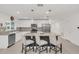 Bright kitchen features granite counters, stainless steel appliances, and a large center island with bar seating at 1877 River Crest Ave, St Cloud, FL 34771