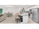 Modern kitchen with granite countertops, stainless steel appliances, and a breakfast bar, connected to the dining area at 1877 River Crest Ave, St Cloud, FL 34771
