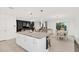 Open floor plan with spacious living room, dining area, and modern kitchen featuring a center island at 1877 River Crest Ave, St Cloud, FL 34771