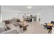 Spacious living area with open layout, combining a comfortable living room, dining space, and modern kitchen at 1877 River Crest Ave, St Cloud, FL 34771
